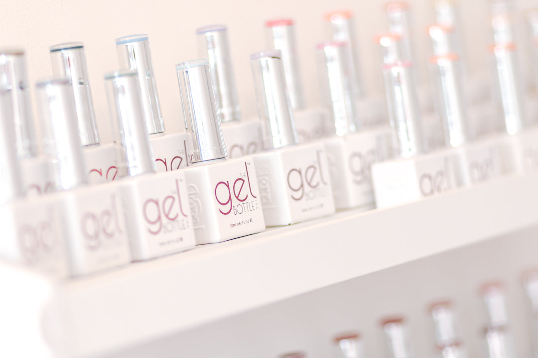 The Gel Bottle BIAB and gel polishes on shelves in nail salon